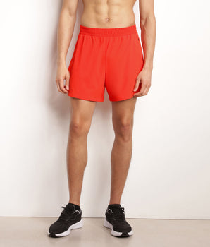 Pantalón corto deportivo de hombre en tejido vaporoso naranja Dim Move